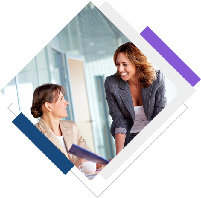 Two women are talking to each other in a room.